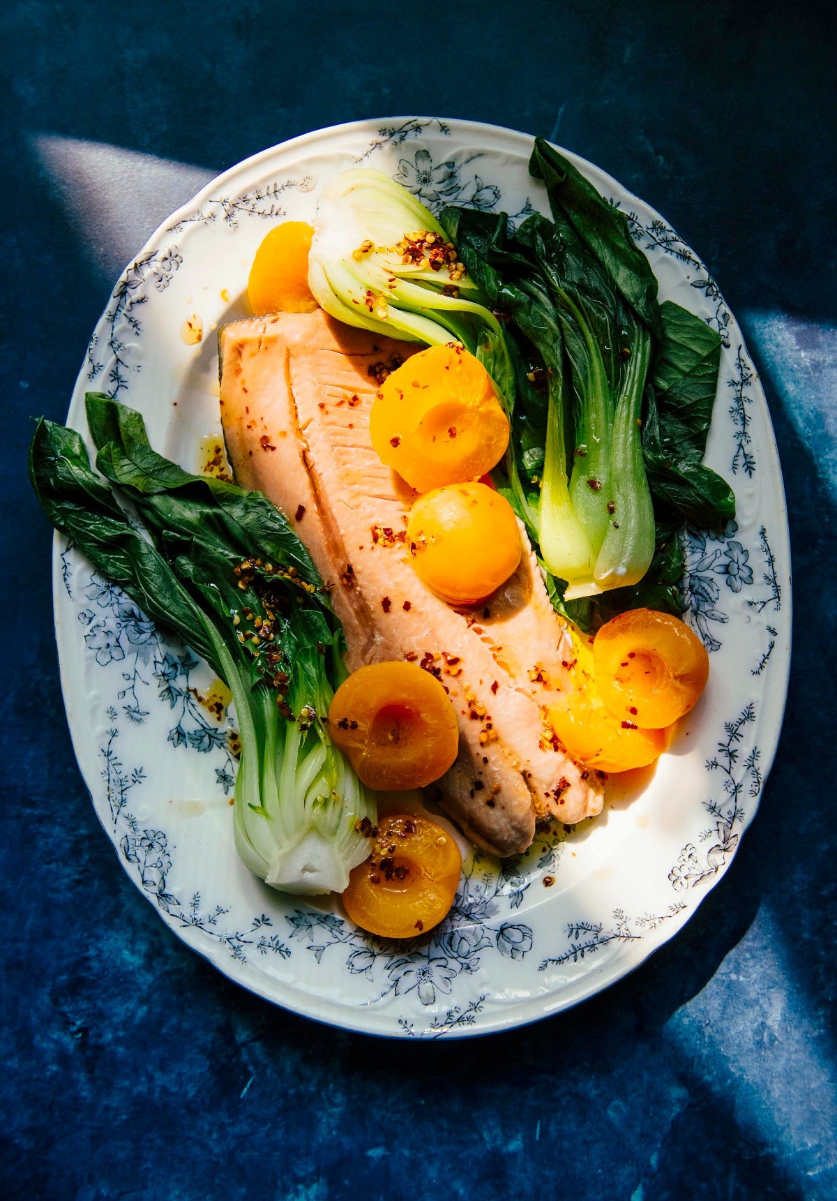 Get Cooking: Ginger-Poached Apricots Over Salmon, Choi + Chili Oil