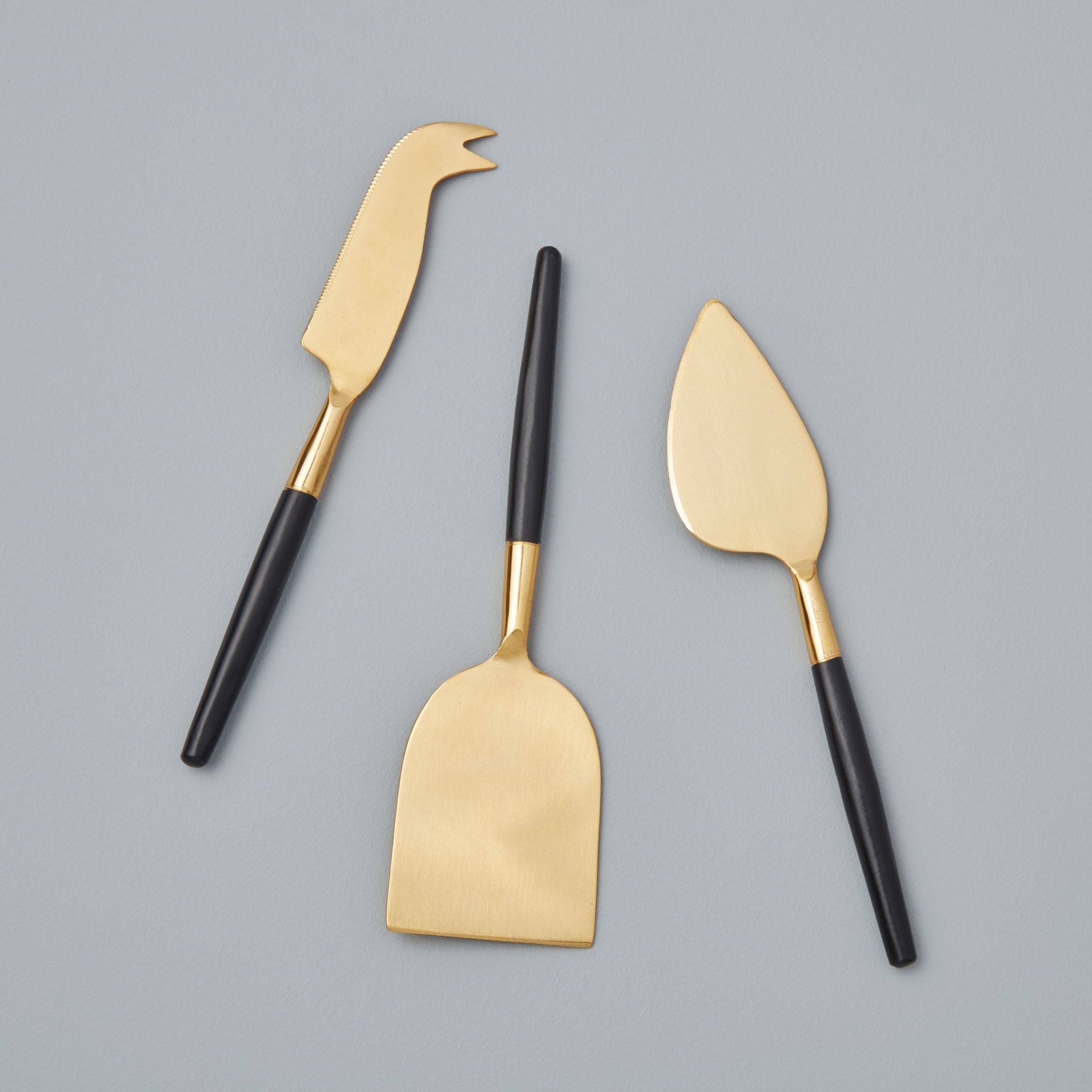 http://behome.com/cdn/shop/products/Be-Home_Black-and-Gold-Cheese-Set-of-3_25-741.jpg?v=1606347558