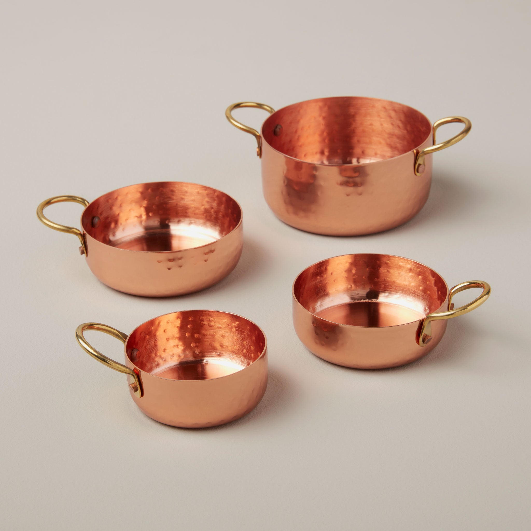 http://behome.com/cdn/shop/products/Be-Home_Hammered-Copper-and-Gold-Measuring-Cups-Set-of-4_25-96.jpg?v=1605548690