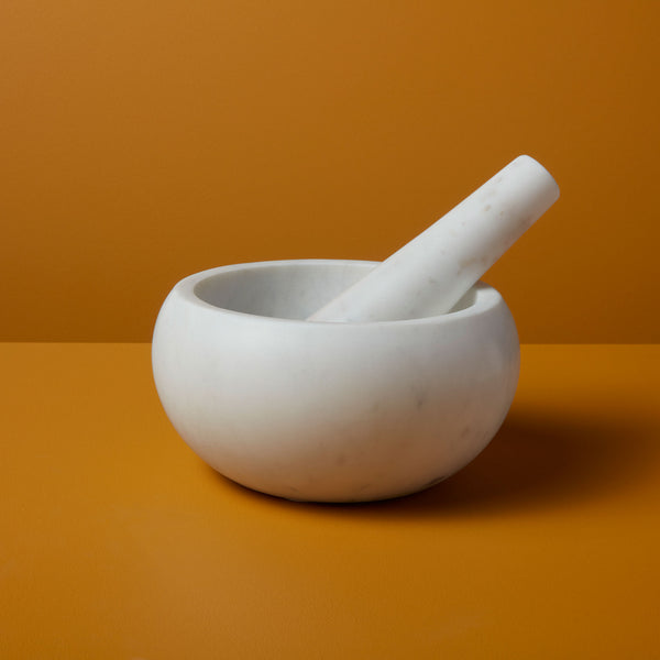 https://behome.com/cdn/shop/products/Be-Home_White-Marble-Mortar-and-Pestle_58-04_grande.jpg?v=1605657702